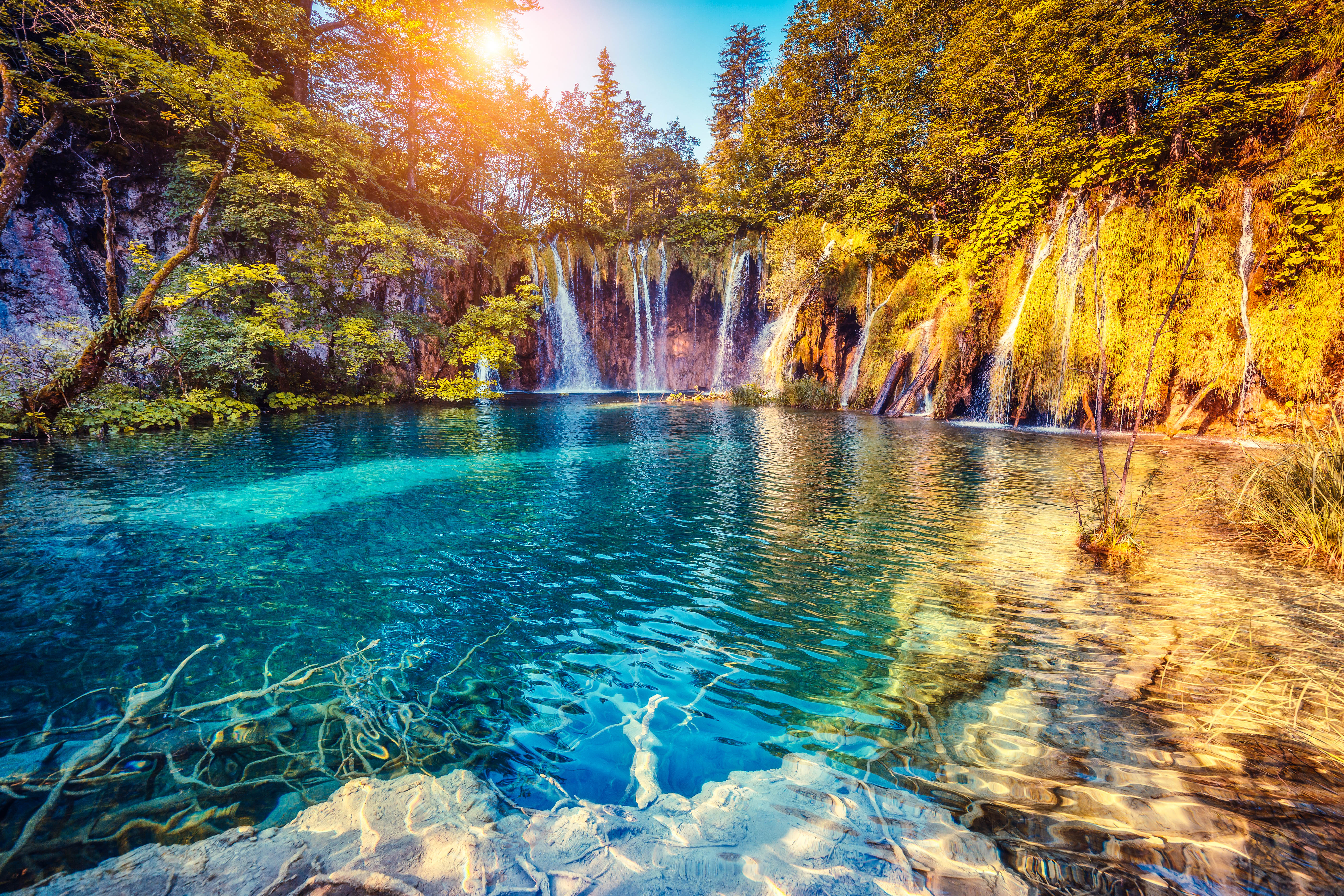 majestic view on turquoise water and sunny beams in the plitvice lakes national park croatia shutterstock_266538056 2