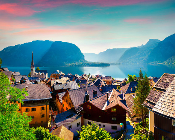 Colorful summer morning in the Hallstatt village in the Austrian Alps. Maria am Berg church and Hallstattersee lake, Austria, Europe.