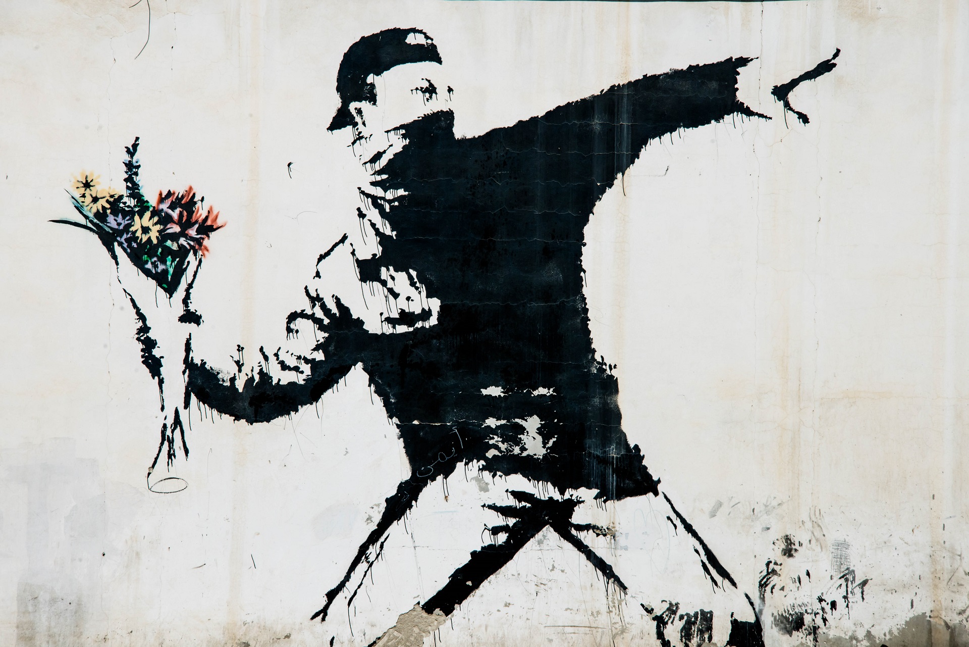 a mural by the british street artist banksy covers a wall in the west bank village shutterstock_336012893 editorial only ryan rodrick beiler 2