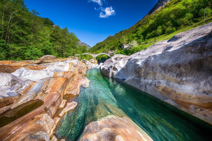 Double arch stone bridge at Ponte dei Salti with waterfall, Lavertezzo, Verzascatal, Canton Tessin shutterstock_431823877-2